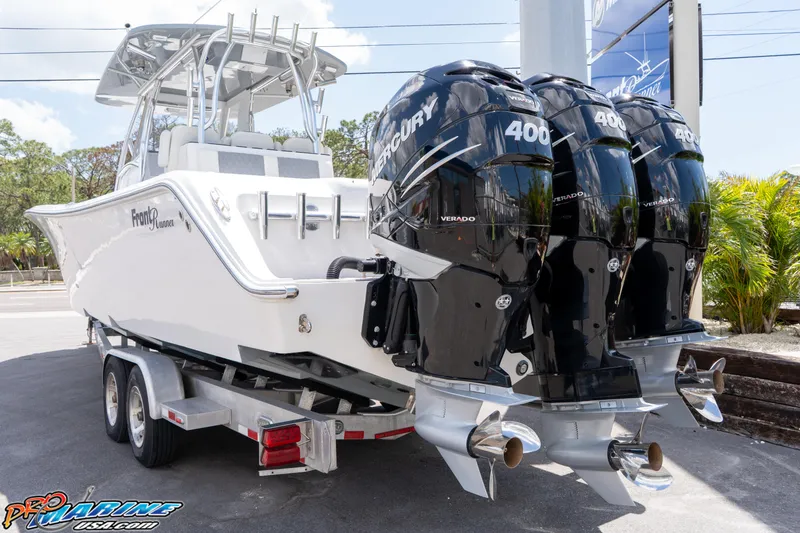 Slide: The Image of 2023 Front Runner 36 Center Console boat with triple Mercury 400 engines on a trailer. - 3