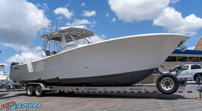 Slide: The Image of 2023 Front Runner 36 Center Console boat on trailer under blue sky. - 6