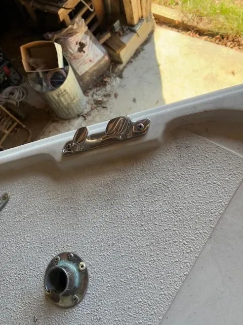 Slide: The Image of Close-up of a 1990 Custom North End Composites Point boat deck with cleat and fitting. - 13