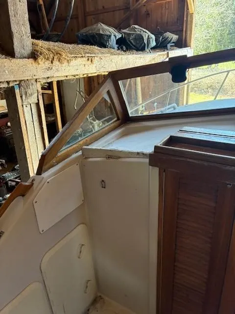 Slide: The Image of 1990 Custom North End Composites Point boat interior in a wooden shed. - 7