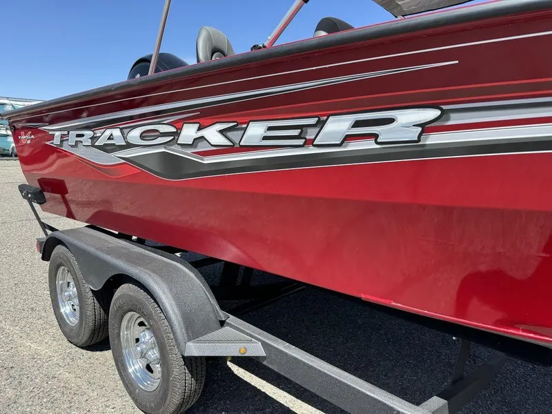 Slide: The Image of 2024 Tracker Targa™ V-18 Combo boat in vibrant red on a trailer. - 12