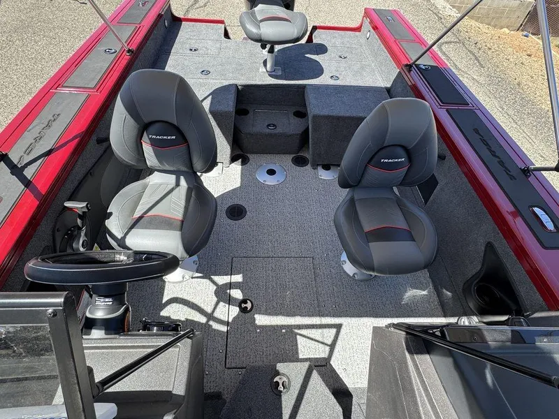Slide: The Image of 2024 Tracker Targa™ V-18 Combo boat interior with seating and steering wheel. - 21