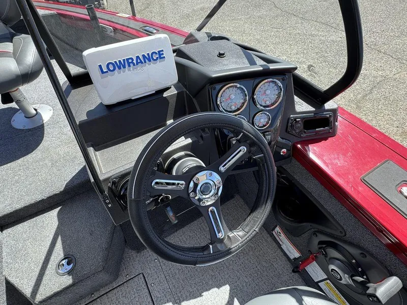 Slide: The Image of 2024 Tracker Targa™ V-18 Combo boat dashboard with Lowrance electronics and steering wheel. - 23