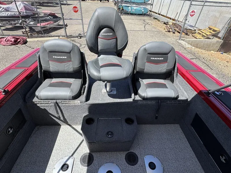 Slide: The Image of 2024 Tracker Targa™ V-18 Combo boat interior with three gray seats and red accents. - 31