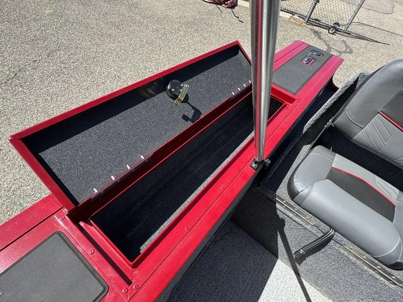 Slide: The Image of 2024 Tracker Targa™ V-18 Combo boat interior with open storage compartment and seating. - 34