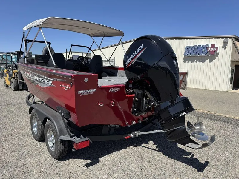 Slide: The Image of 2024 Tracker Targa™ V-18 Combo boat with Mercury engine, parked outdoors. - 44
