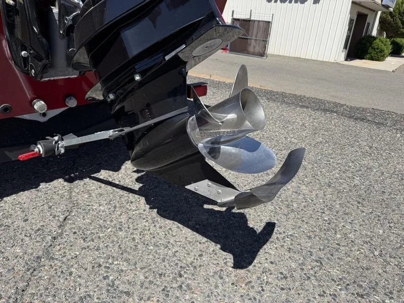 Slide: The Image of 2024 Tracker Targa™ V-18 Combo boat propeller on asphalt surface. - 45