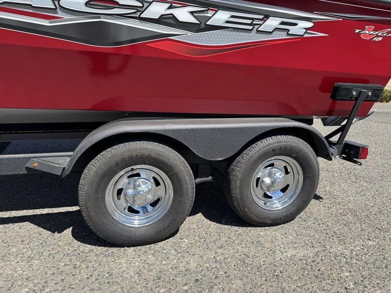 Slide: The Image of 2024 Tracker Targa™ V-18 Combo boat trailer with dual wheels, red exterior. - 47
