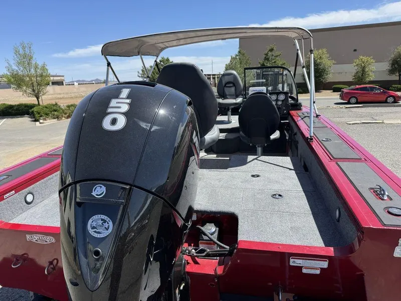 Slide: The Image of 2024 Tracker Targa™ V-18 Combo boat with powerful 150 engine, red exterior, and spacious interior. - 5