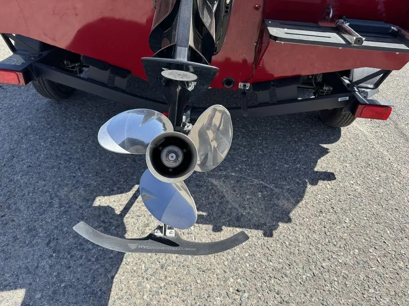 Slide: The Image of 2024 Tracker Targa™ V-18 Combo boat propeller on asphalt surface. - 7