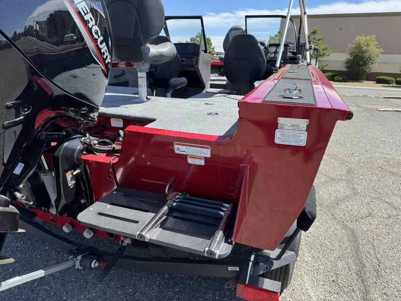 Slide: The Image of 2024 Tracker Targa™ V-18 Combo boat with Mercury engine, rear view showing seating and ladder. - 8