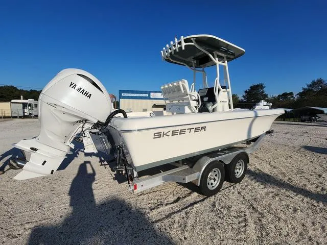 Slide: The Image of 2025 Skeeter SX2350 boat with Yamaha engine on trailer, parked outdoors. - 5