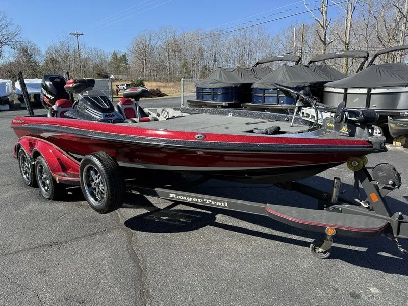 Slide: The Image of 2016 Ranger Z520C bass boat on trailer, red and black, parked outdoors. - 3