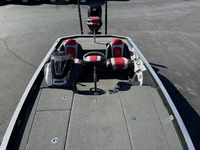 Slide: The Image of 2016 Ranger Z520C boat interior with red and black seats, spacious deck. - 5