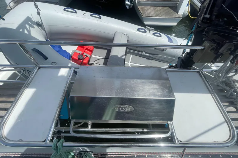 Slide: The Image of Seawind 1000 catamaran deck with stainless steel grill and inflatable dinghy, 2001 model. - 32