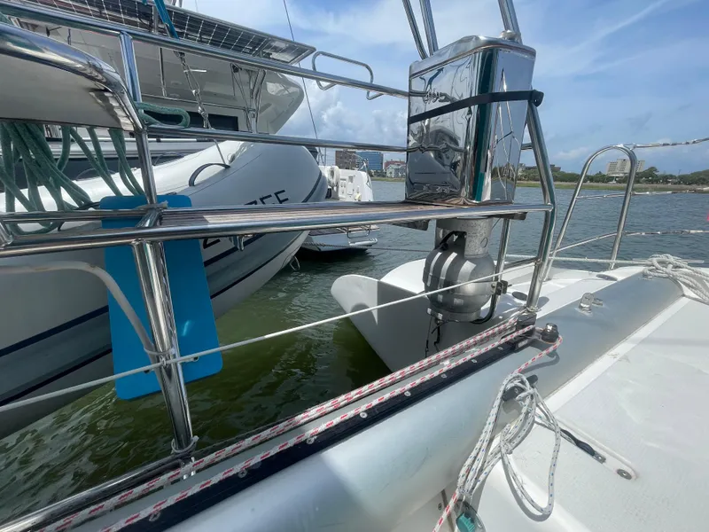 Slide: The Image of Sailboat docked in marina, Seawind 1000, 2001 model, with clear skies and calm waters. - 34