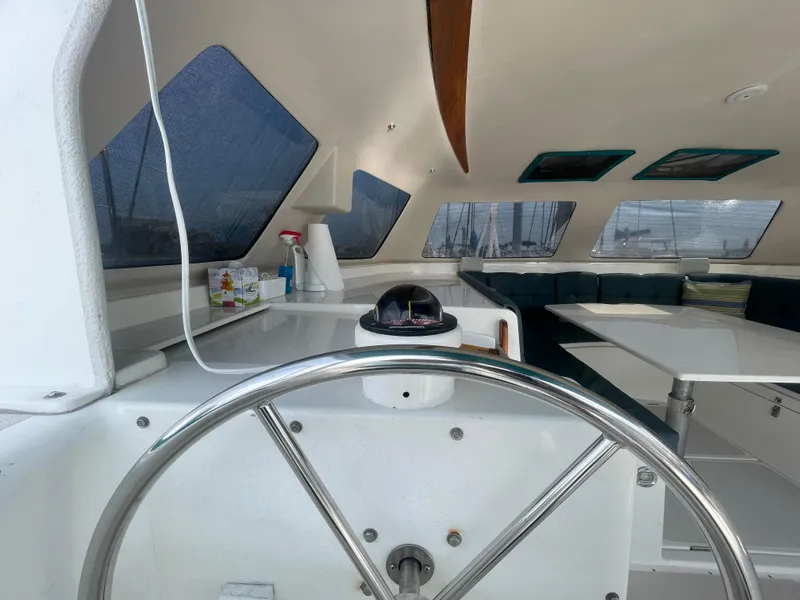 Slide: The Image of Interior view of 2001 Seawind 1000 catamaran, featuring helm and spacious seating area. - 45