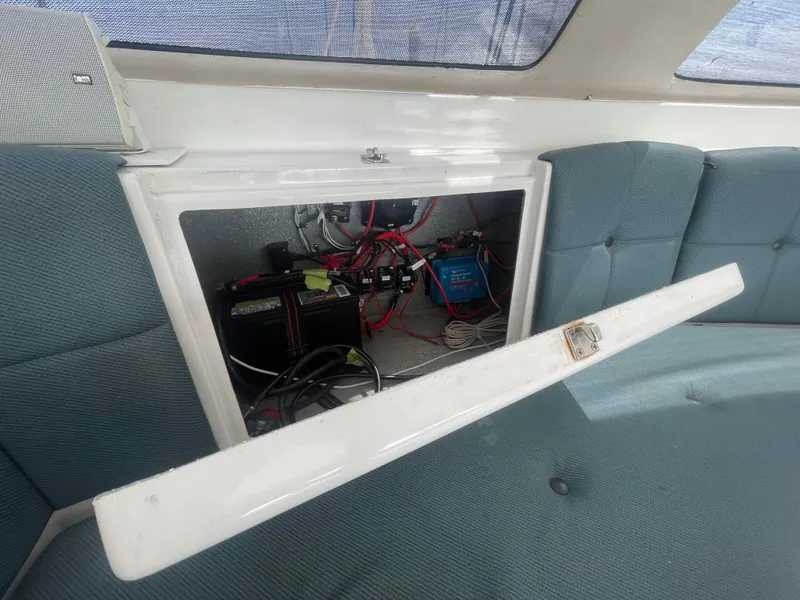 Slide: The Image of Seawind 1000 (2001) interior showing open electrical panel with wiring and components. - 49