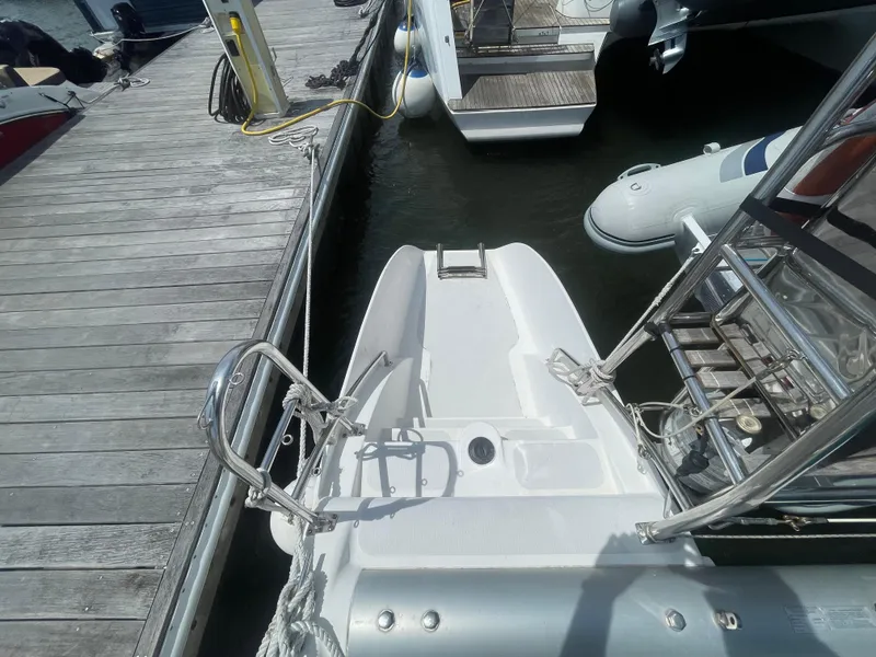 Slide: The Image of Seawind 1000 catamaran docked, showing stern and boarding ladder, 2001 model. - 5