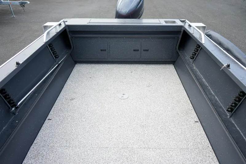 Slide: The Image of 2025 Alumaweld Stryker X202 boat interior with spacious, durable deck and storage compartments. - 10