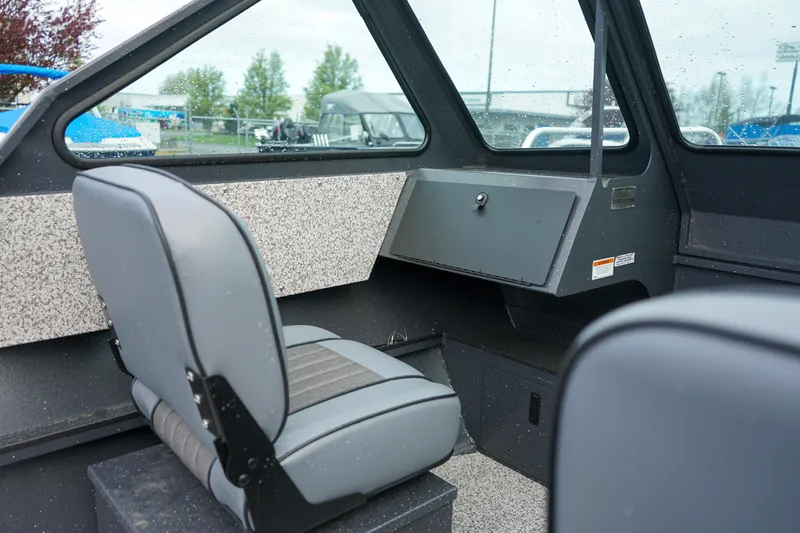 Slide: The Image of Interior of 2025 Alumaweld Stryker X202 boat with gray seating and dashboard. - 14