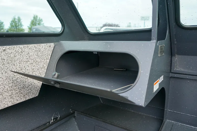 Slide: The Image of Interior storage compartment of 2025 Alumaweld Stryker X202 boat, open and empty. - 15