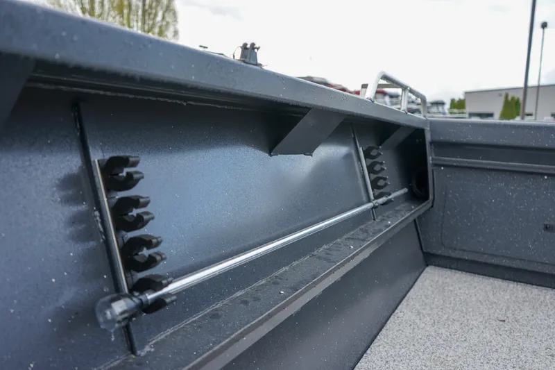 Slide: The Image of 2025 Alumaweld Stryker X202 boat interior with rod holders and storage compartments. - 16