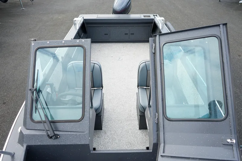 Slide: The Image of 2025 Alumaweld Stryker X202 boat interior with open windshield and seating. - 25