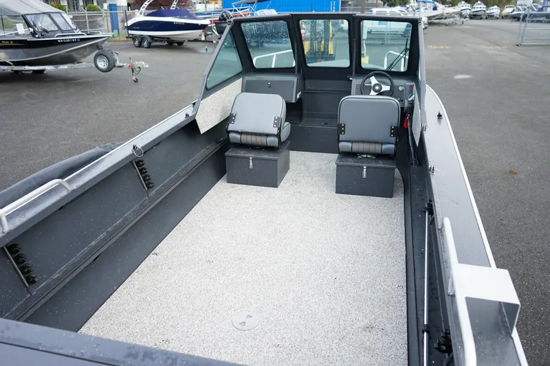 Slide: The Image of 2025 Alumaweld Stryker X202 boat interior with seating and steering wheel. - 9