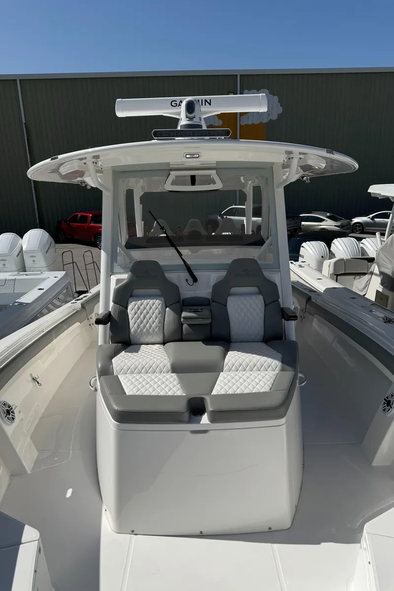 Slide: The Image of 2025 Regulator 37 boat with cushioned seating and advanced navigation system. - 12