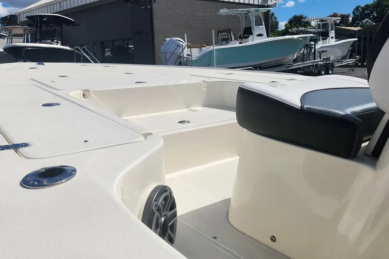 Slide: The Image of 2026 ShearWater X22 HYBRID boat interior with seating and storage compartments. - 12