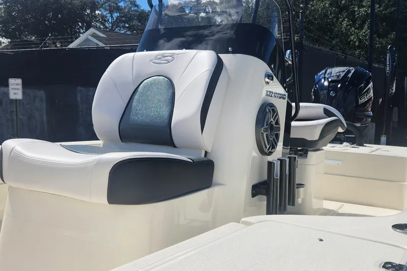 Slide: The Image of 2026 ShearWater X22 HYBRID boat interior with sleek seating and modern design. - 13