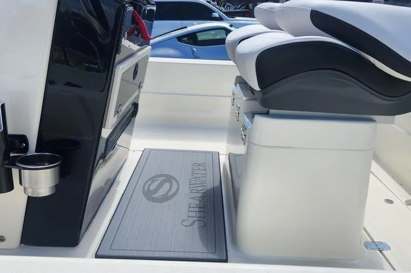 Slide: The Image of Interior of 2026 ShearWater X22 HYBRID boat with seating and console details. - 8