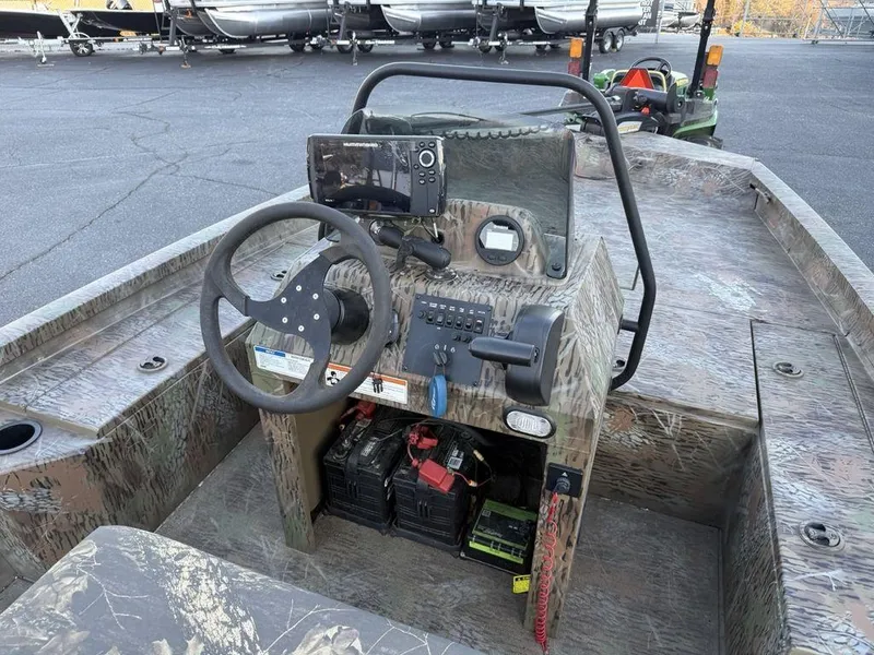 Slide: The Image of 2019 G3 Gator Tough 20 CCJ boat interior with steering console and controls. - 12