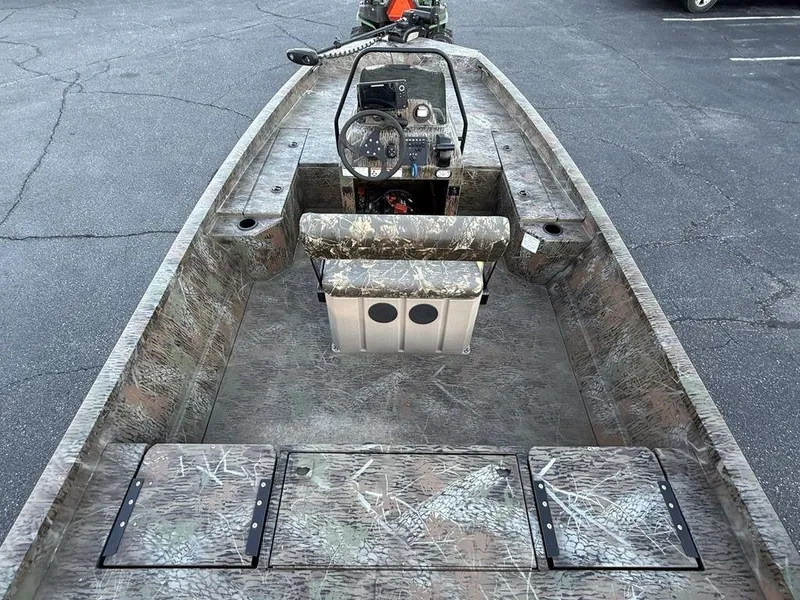Slide: The Image of 2019 G3 Gator Tough 20 CCJ boat interior with camouflage design and central console. - 18