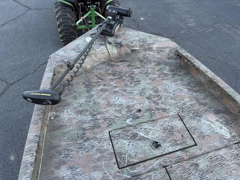 Slide: The Image of 2019 G3 Gator Tough 20 CCJ boat with camo pattern and trolling motor. - 6