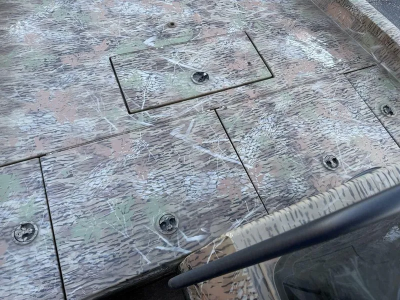 Slide: The Image of 2019 G3 Gator Tough 20 CCJ boat deck with camouflage pattern and storage compartments. - 8