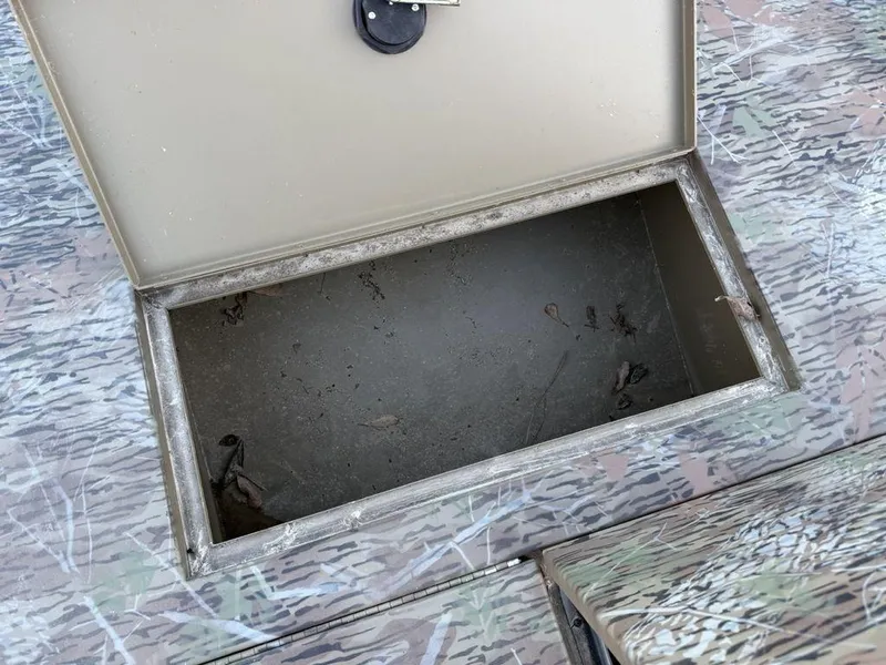 Slide: The Image of Open storage compartment on 2019 G3 Gator Tough 20 CCJ boat. - 9