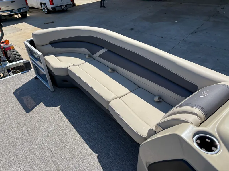Slide: The Image of 2023 Barletta CABRIO 24 UC boat interior with gray seating and cup holder. - 11