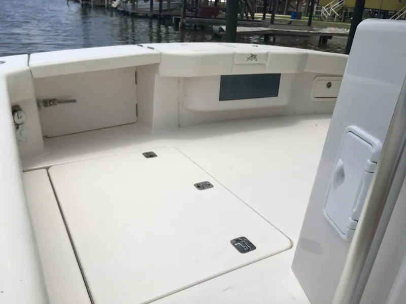 Slide: The Image of 2008 Calcutta 390 boat deck with storage compartments near water. - 10