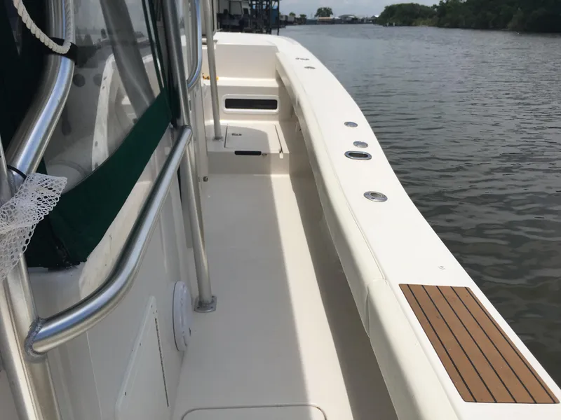 Slide: The Image of 2008 Calcutta 390 boat deck with railing, docked on calm water. - 12