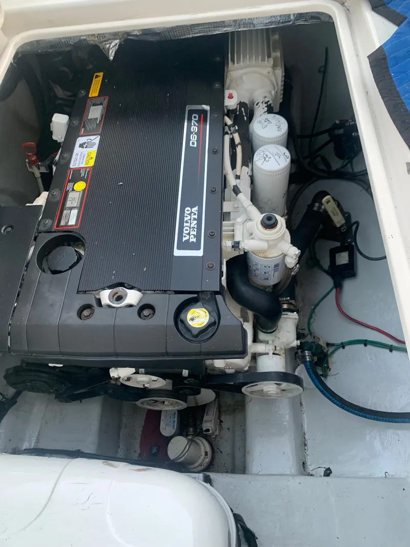 Slide: The Image of Volvo Penta engine in a 2008 Calcutta 390 boat, showcasing detailed components. - 24