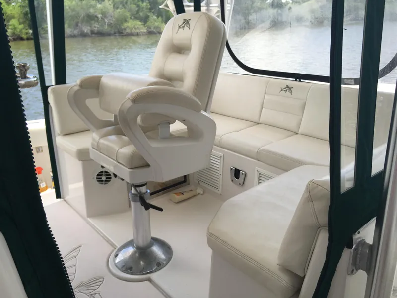 Slide: The Image of 2008 Calcutta 390 boat interior with white seating and river view. - 5