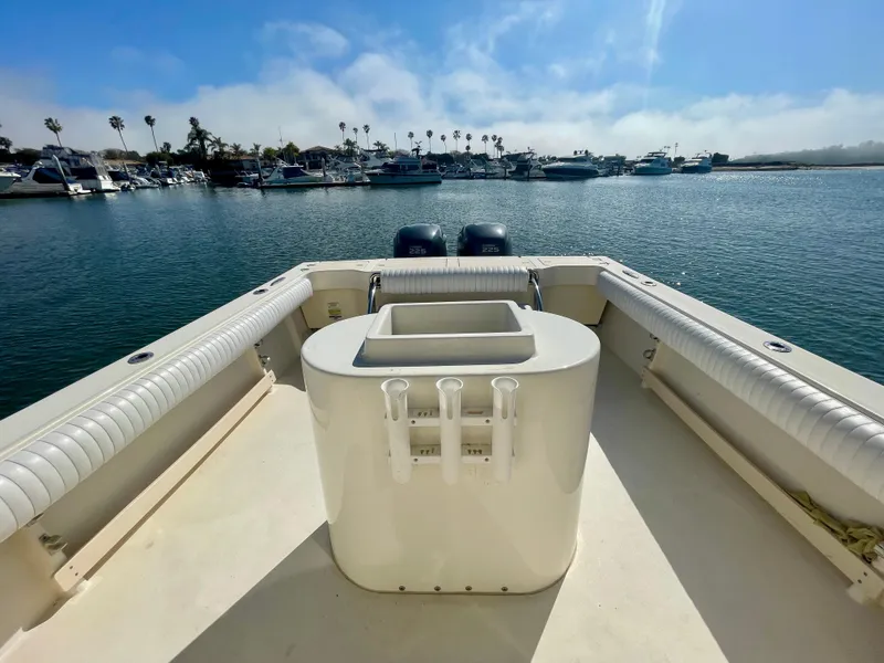 Slide: The Image of 2008 Parker 2520 DV boat deck with ocean view and marina backdrop. - 19