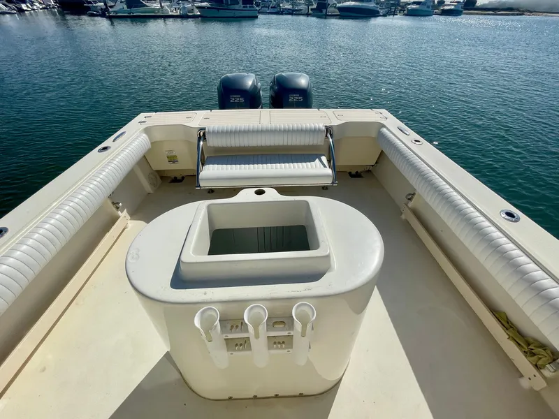 Slide: The Image of 2008 Parker 2520 DV boat deck with seating and storage, docked at marina. - 20