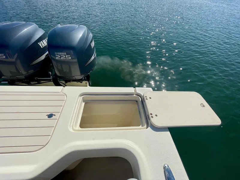 Slide: The Image of 2008 Parker 2520 DV boat with Yamaha 225 engines on calm water. - 21