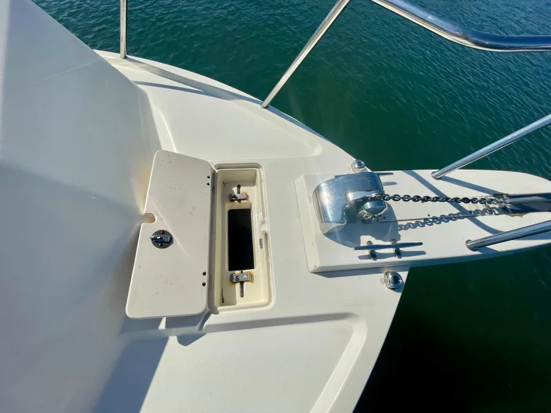 Slide: The Image of Bow of 2008 Parker 2520 DV boat with anchor chain and storage compartment. - 24