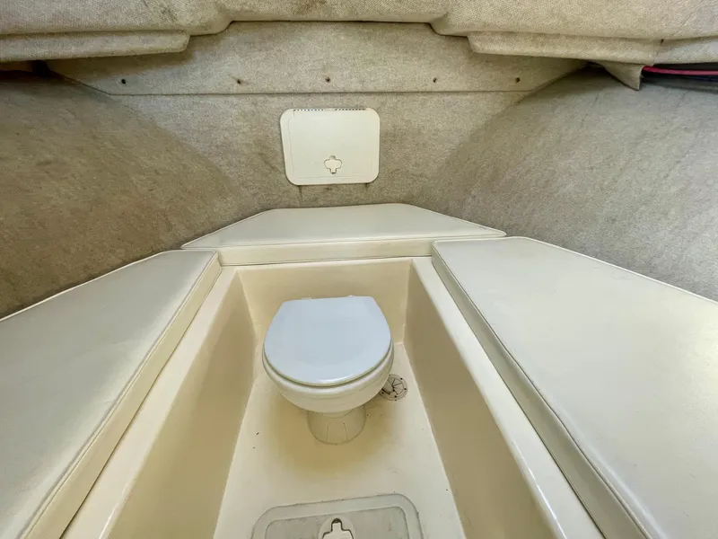 Slide: The Image of 2008 Parker 2520 DV boat interior with compact marine toilet. - 7