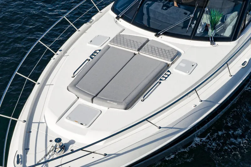 Slide: The Image of 2023 Riviera 5400 Sport Yacht with sunbathing deck on calm waters. - 15