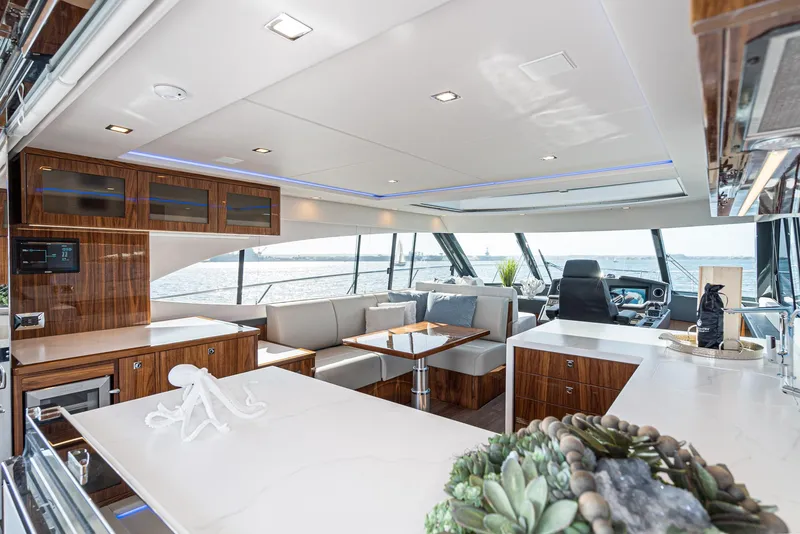 Slide: The Image of Luxurious interior of 2023 Riviera 5400 Sport Yacht with modern design and panoramic windows. - 26